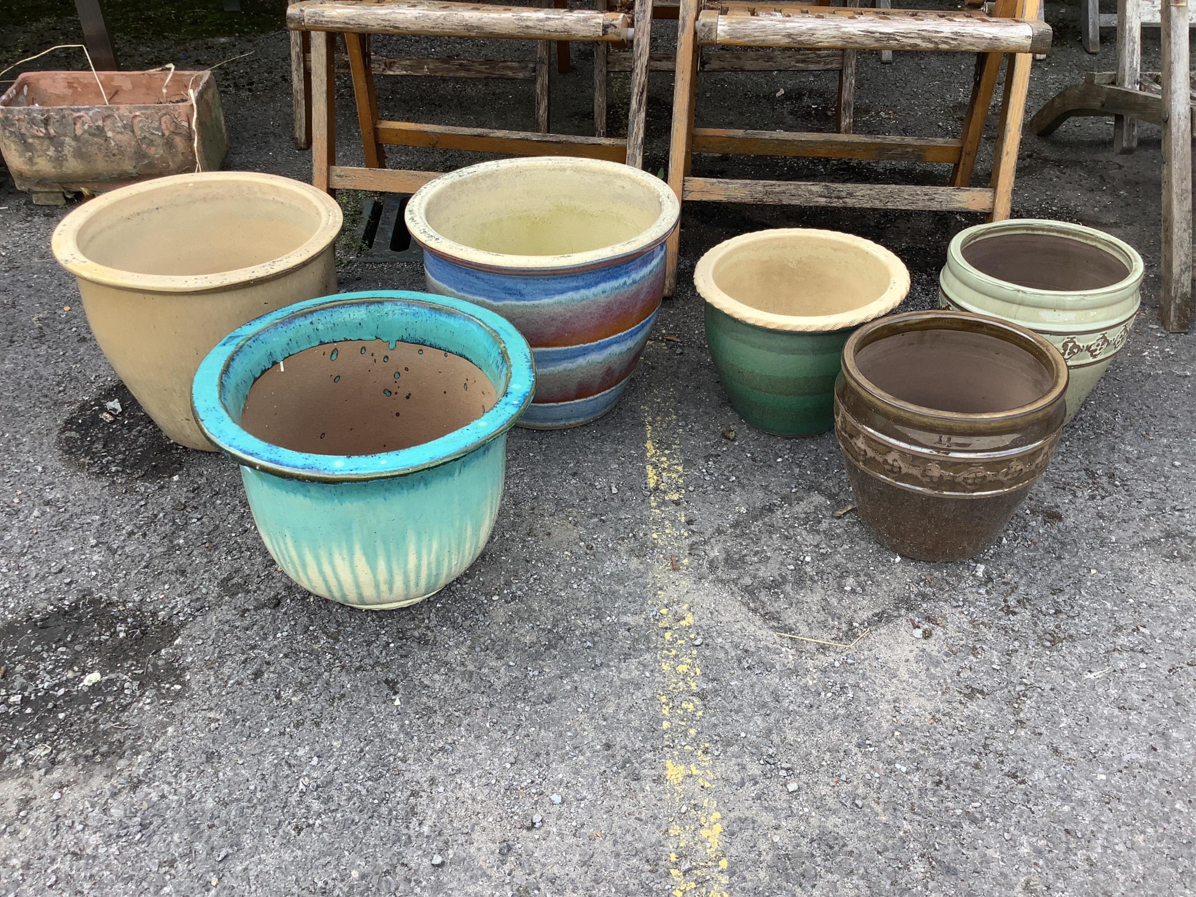 Six glazed earthenware circular garden planters, largest diameter 38cm, height 32cm. Condition - fair